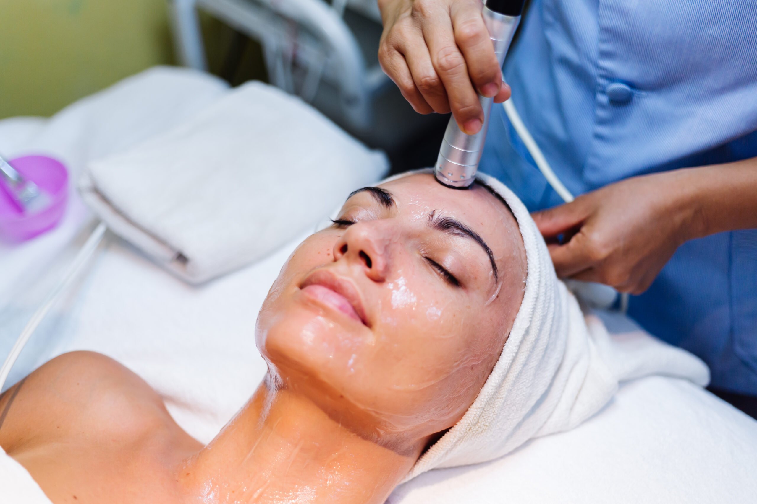 young-woman-lying-cosmetologist-s-table-during-rejuvenation-procedure